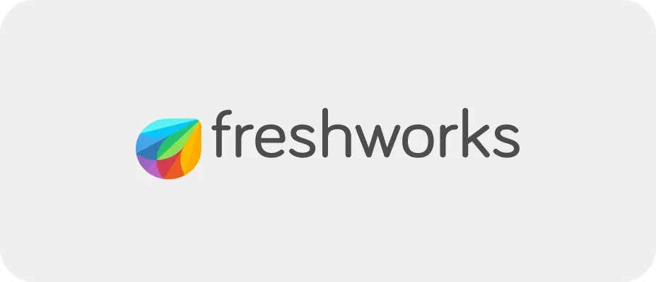 Original Freshworks logo: the multicolored leaf mark beside a light gray lowercase wordmark